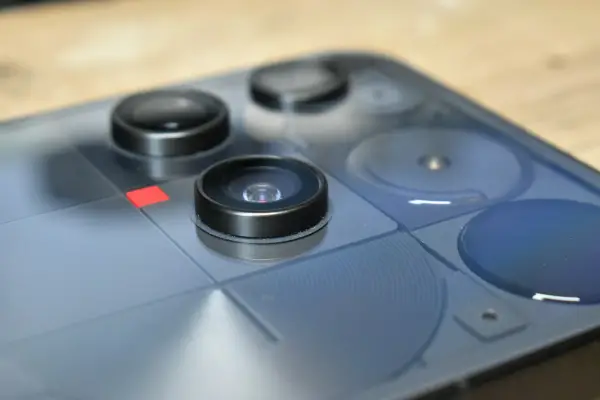 Close-up of a blue smartphone's rear camera lenses
