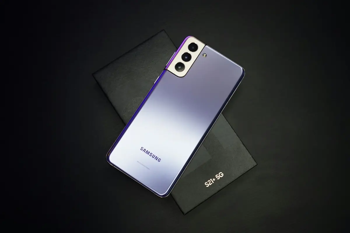 Violet Samsung Galaxy phone lying on a dark surface